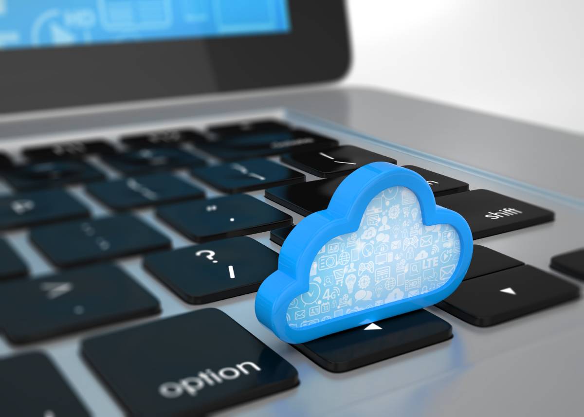 Digital Cloud sitting on top of laptop