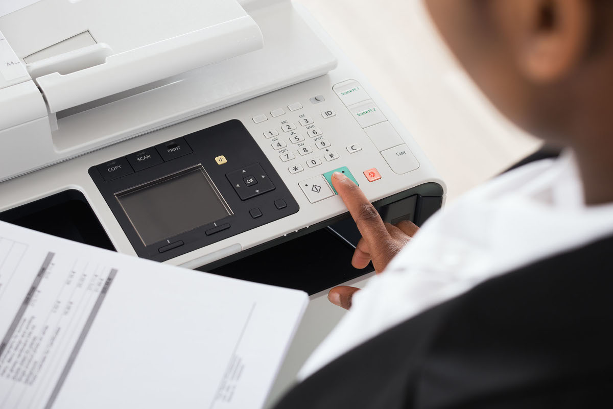 Woman using office printer