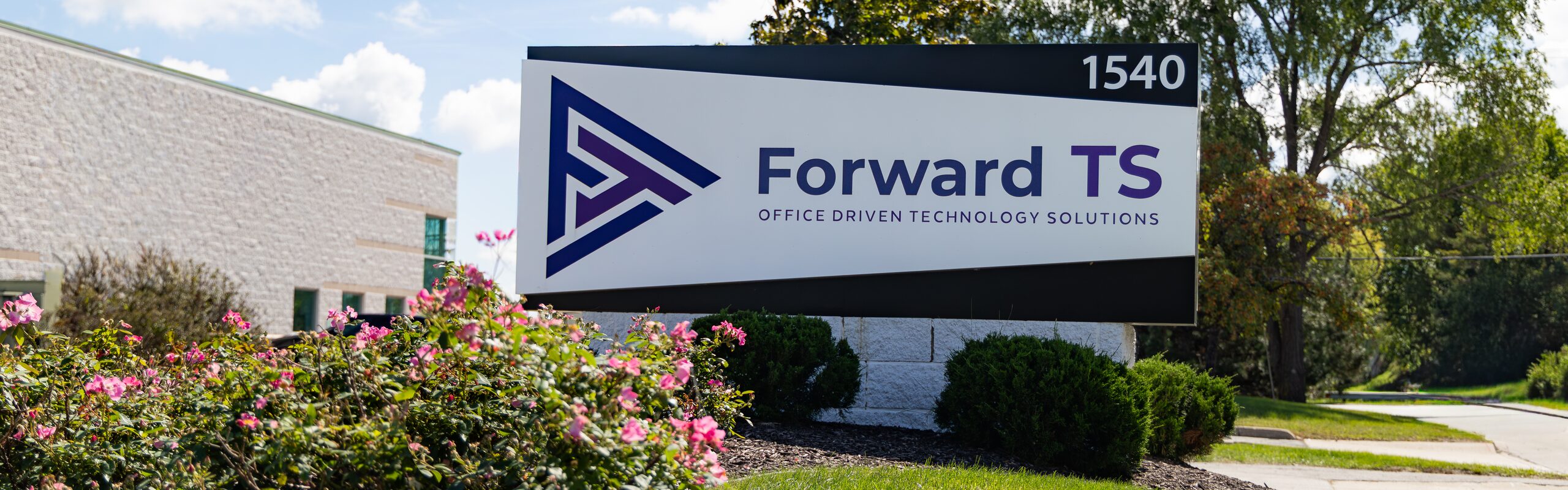 Close view of the Forward TS monument sign at 1540 with the company logo and Office Driven Technology Solutions tagline.